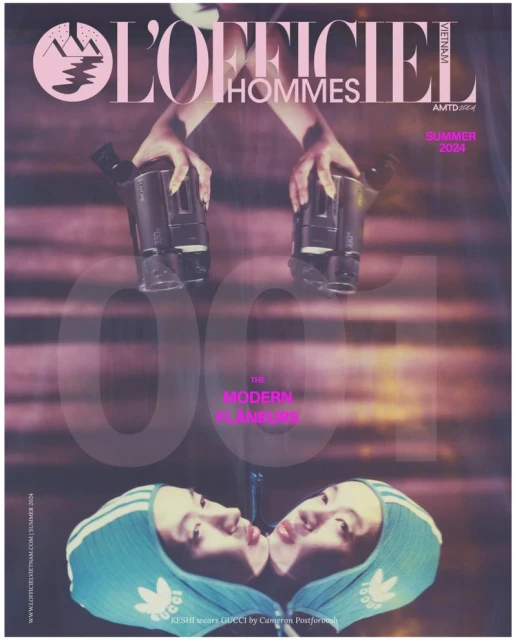 Magazine cover features mirrored faces in turquoise caps, holding vintage cameras, with L'Officiel Hommes logo and summer 2024 text.