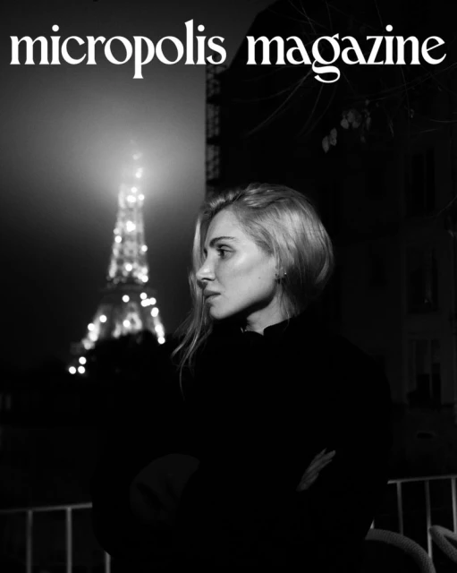Black and white magazine cover shot of a blonde woman, Eiffel Tower in the background, atmospheric, with 'micropolis magazine' text.