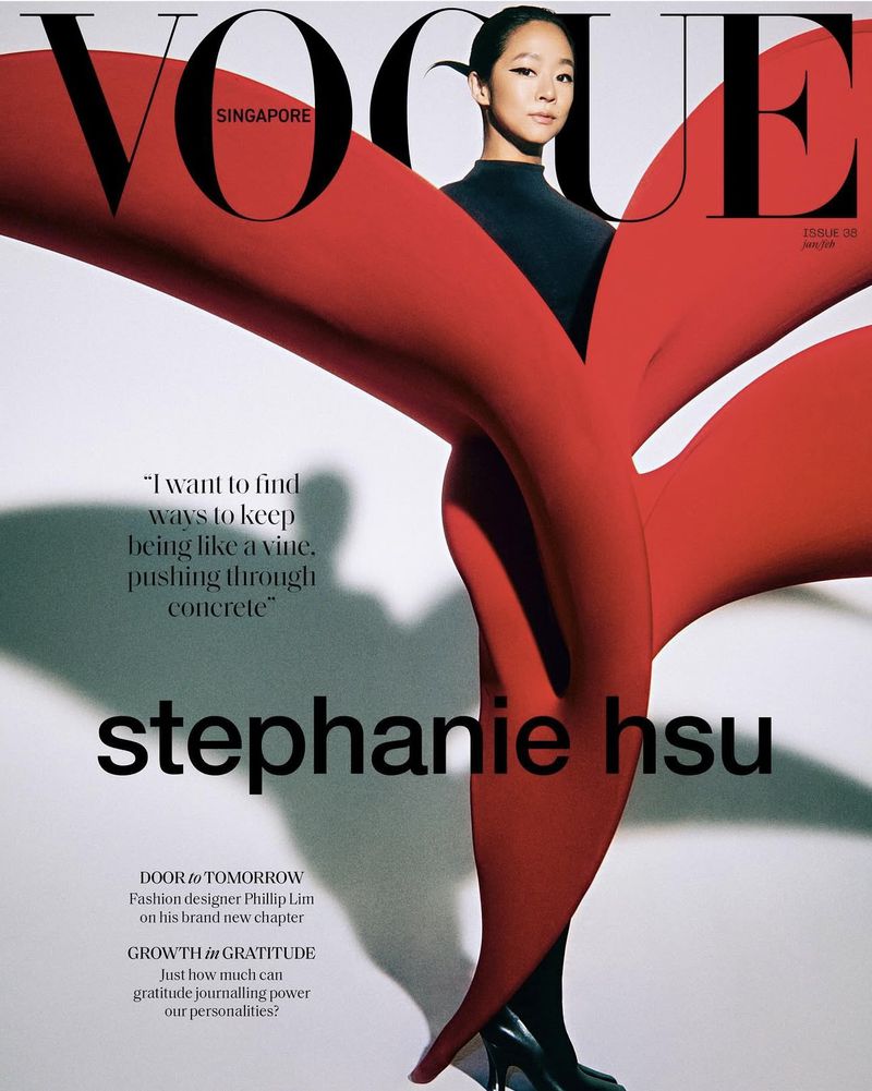 Vogue Singapore cover featuring Stephanie Hsu in a black top and abstract red fabric over a white background. Issue 26, July/August.