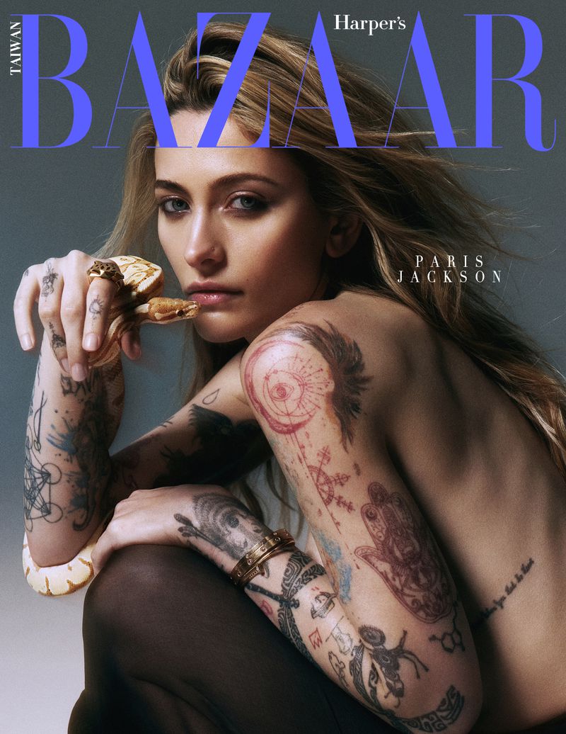 Paris Jackson on the cover of Harper's Bazaar Taiwan, posing with a snake, featuring tattoos, jewelry, and editorial fashion styling.