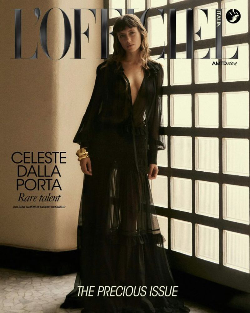 Magazine cover featuring a woman in a black dress posing in front of a gridded window, with magazine title L'Officiel Italia.