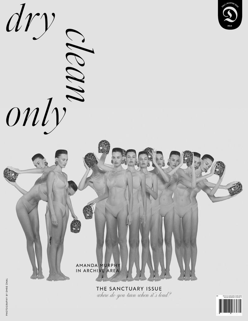 Black and white editorial fashion photograph featuring a group of nude female models holding masks in a photo studio. Fashion photography.