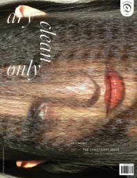 Close-up portrait of a model's face partially obscured by straight dark brown hair with glossy red lipstick for Dry Clean Only magazine cover