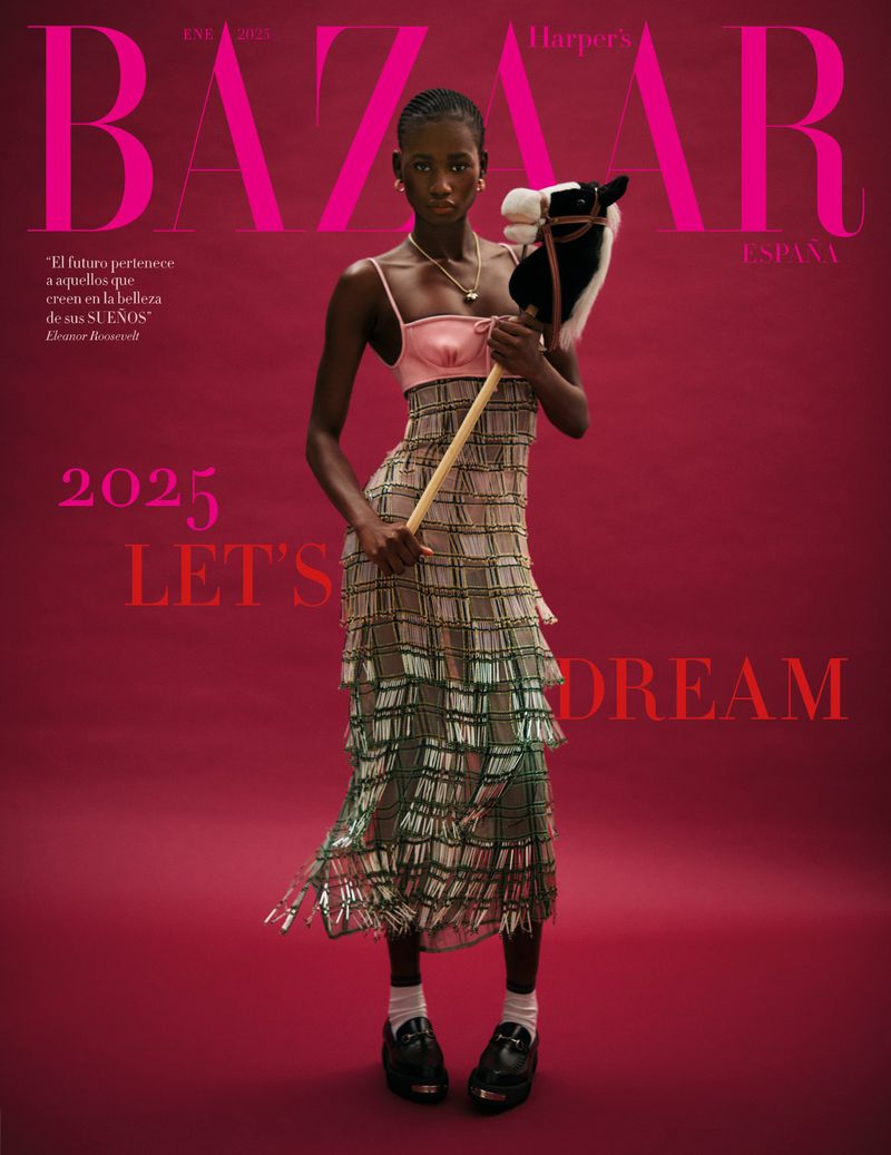 Harper's Bazaar España cover featuring a Black female model in a tiered dress holding a hobby horse against a red background.