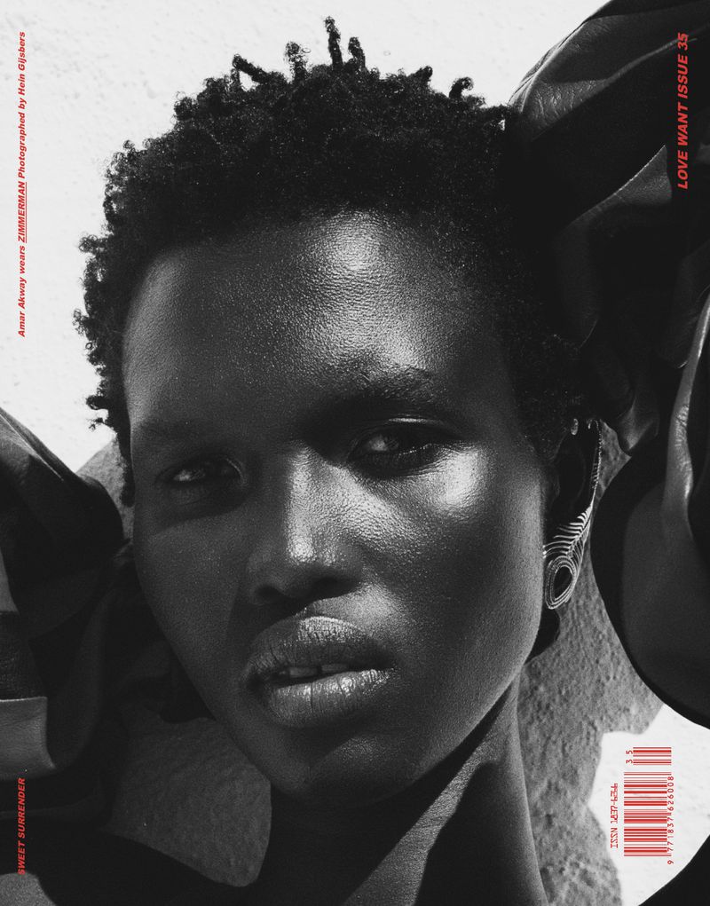 Black and white close-up portrait of model Amar Akway wearing a sculptural ear cuff for Love Want Magazine Issue 35.