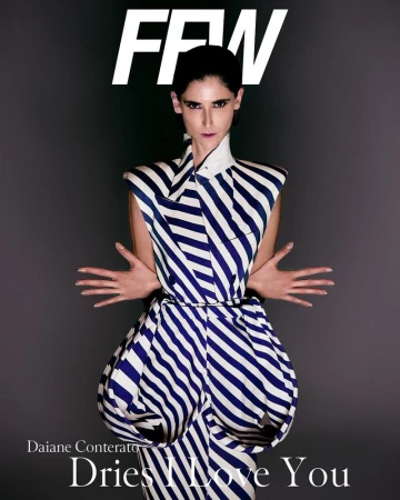 Model Daiane Conterato wearing a structured blue and white striped sleeveless dress against a dark grey studio background.