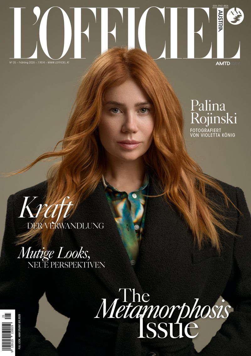 L'Officiel Austria magazine cover featuring redhead model Palina Rojinski wearing a dark coat, with magazine text overlay.