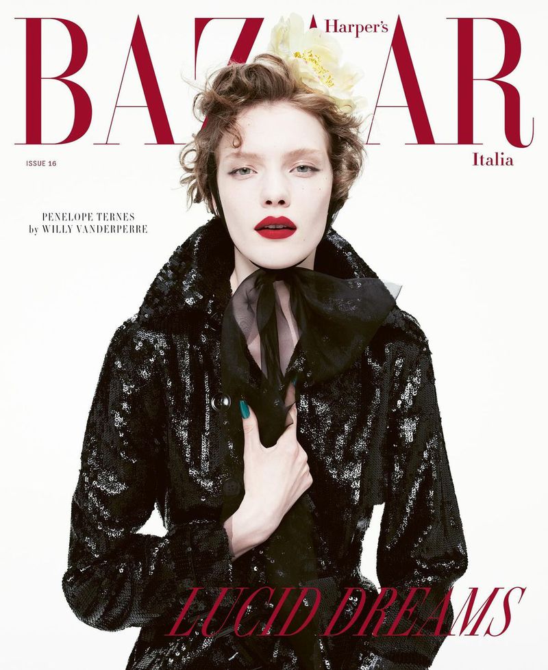 Fashion magazine cover featuring a woman with red lipstick, wearing a black sequined jacket, styled with a flower in her hair.