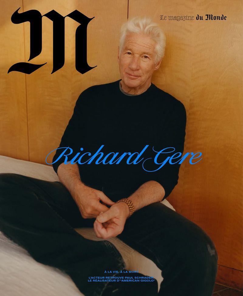Richard Gere on the cover of Le magazine du Monde, in a medium shot, wearing a black long-sleeved shirt and black pants, seated indoors.