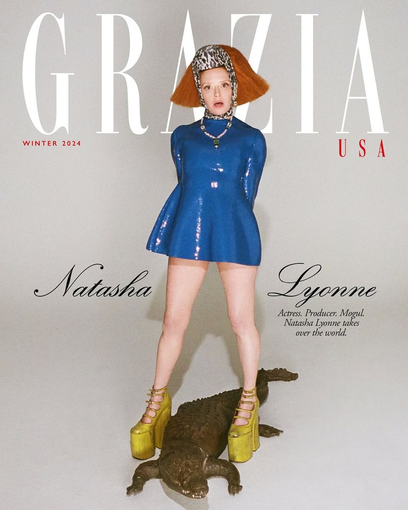 Natasha Lyonne, actress, producer, and mogul, graces the cover of Grazia USA Winter 2024, wearing a blue dress, and animal print head covering.