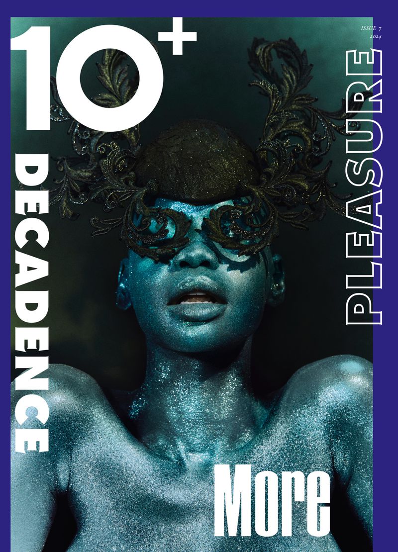 Magazine cover featuring a glittering woman with decorative eyewear, set against a dark teal backdrop with bold white typography and purple accents.