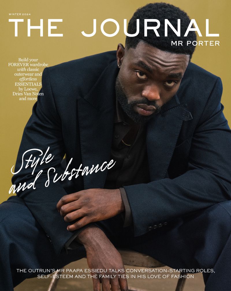 Portrait of actor Paapa Essiedu in a dark suit jacket against a solid mustard yellow background for Mr Porter.