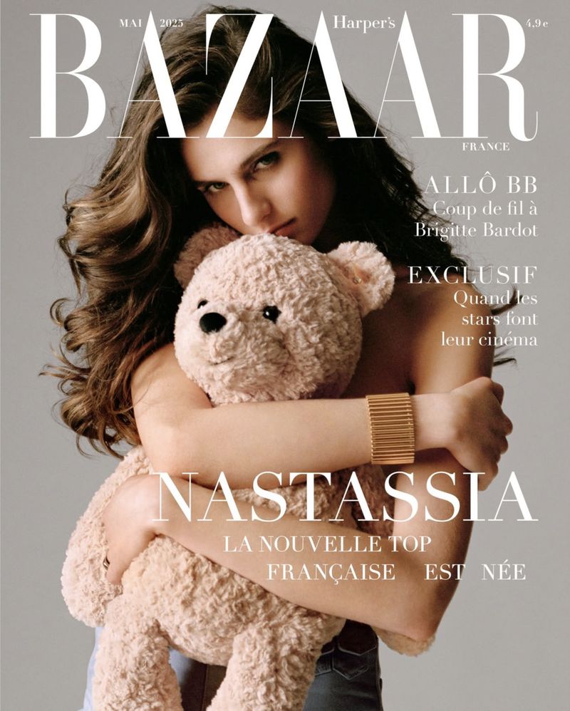 Harper's Bazaar France cover featuring a young adult female model with long brown hair, holding a teddy bear against a grey background.