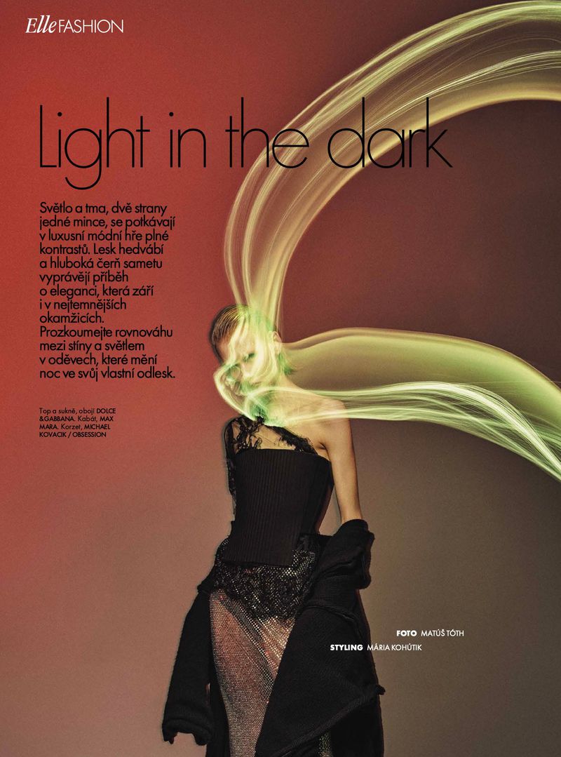 Fashion editorial featuring a woman in a black dress and dramatic green light streaks, with 'Elle Fashion' logo and magazine text.