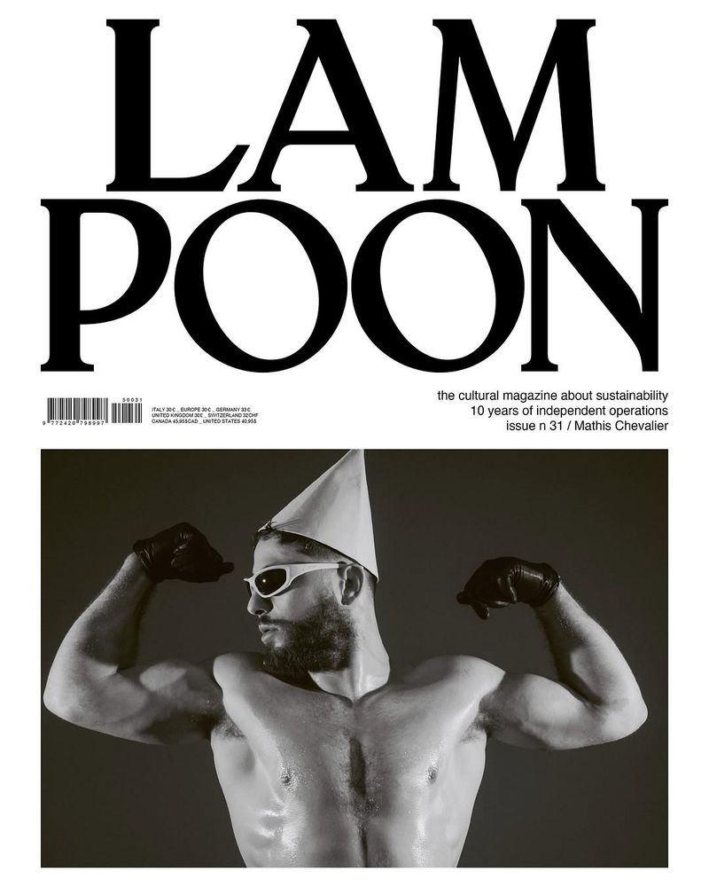 Magazine cover featuring a shirtless male model with sunglasses and party hat flexing his muscles, against a dark backdrop, 'LAMPOON' headline above.