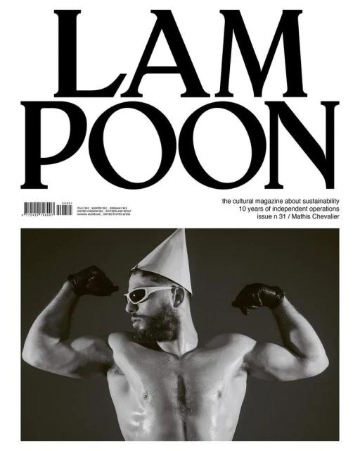 Magazine cover featuring a shirtless male model with sunglasses and party hat flexing his muscles, against a dark backdrop, 'LAMPOON' headline above.