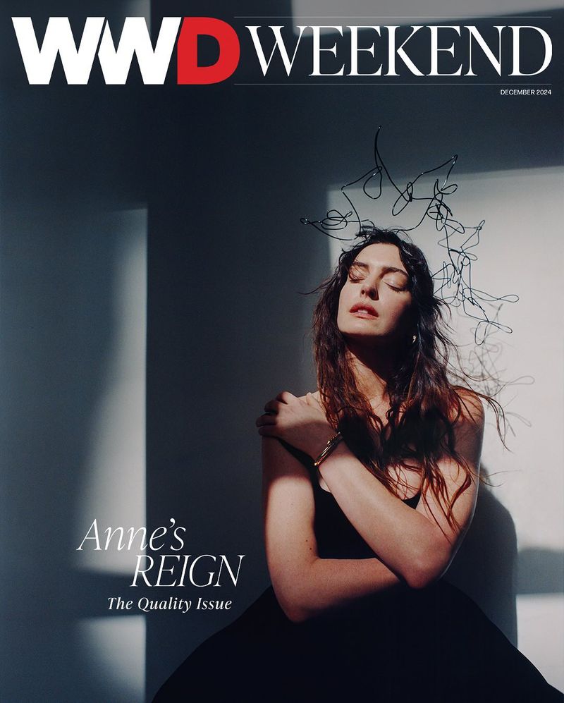 Magazine cover featuring a woman with a decorative headpiece, eyes closed, wearing a black dress against a gradient gray background.
