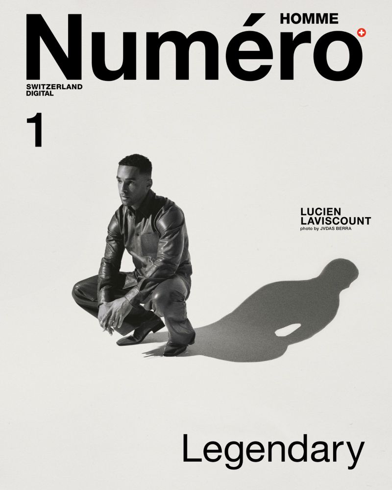 Numero Homme magazine cover featuring Lucien Laviscount in a black leather jacket and pants, posing in front of a white background.