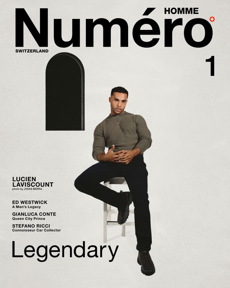 Magazine cover featuring Lucien Laviscount in a medium shot, casually sitting on a stool, against a clean, bright backdrop with bold text.