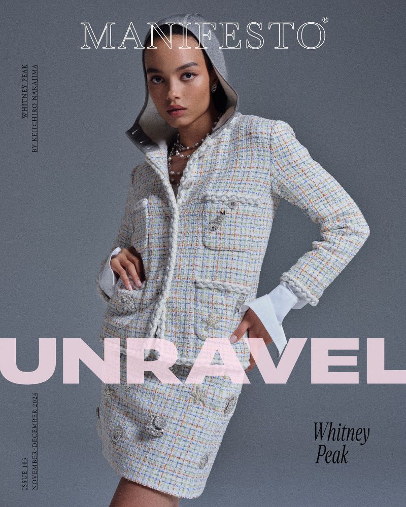 Magazine cover featuring a woman in a tweed suit with a hooded detail, accessorized with a pearl necklace, against a grey backdrop.