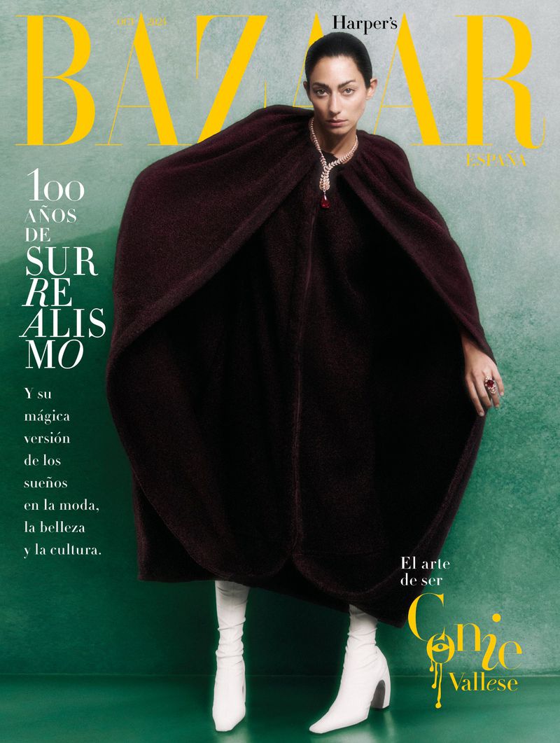 Fashion magazine cover featuring a woman in a brown cape and white boots against a green background with yellow text. Harper's Bazaar.