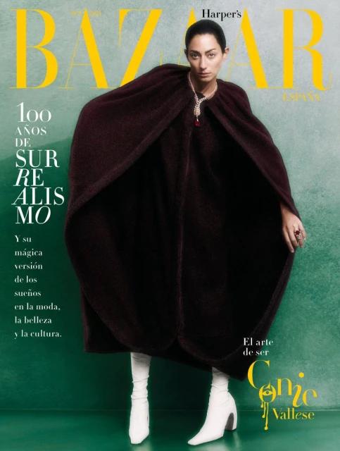 Fashion magazine cover featuring a woman in a brown cape and white boots against a green background with yellow text. Harper's Bazaar.