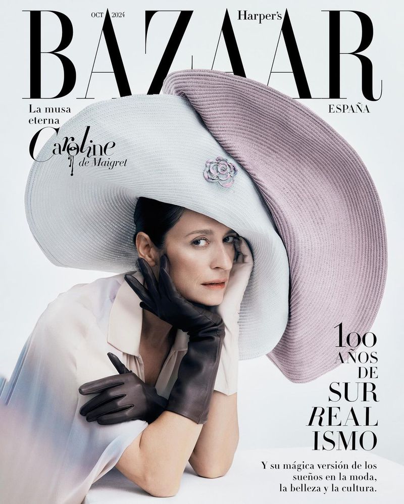 Magazine cover featuring a woman in a large hat and gloves, photographed in a photo studio with visible fashion and style elements.