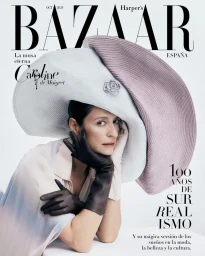 Caroline de Maigret wearing an oversized wide-brim hat and dark gloves for Harper's Bazaar España October 2024 cover.
