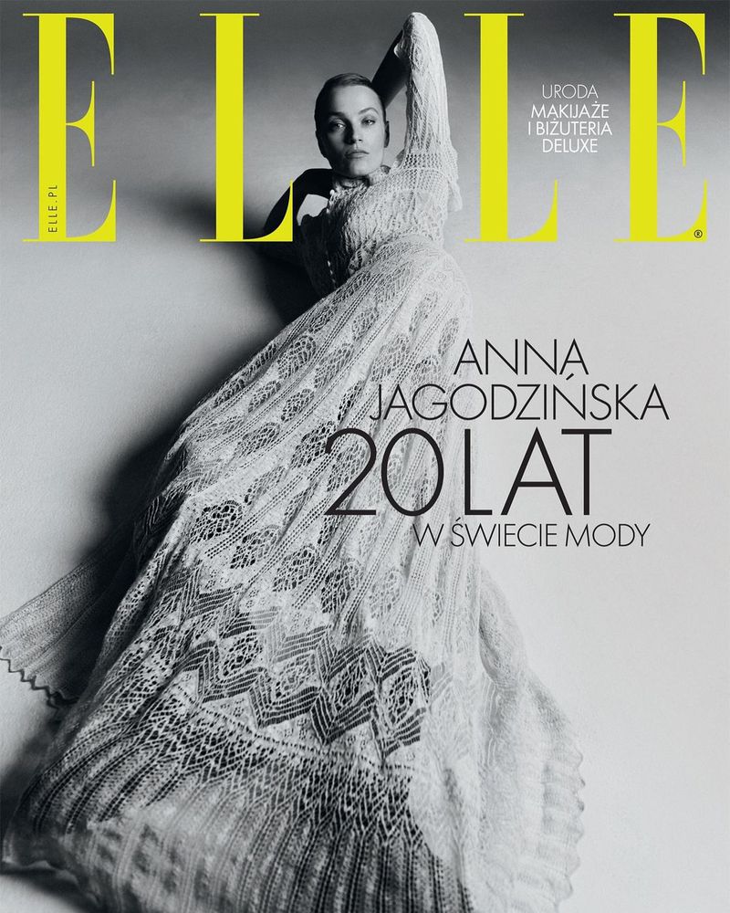 Elle magazine cover featuring Anna Jagodzinska in a long white lace dress, with yellow 'Elle' logo and black and white background.