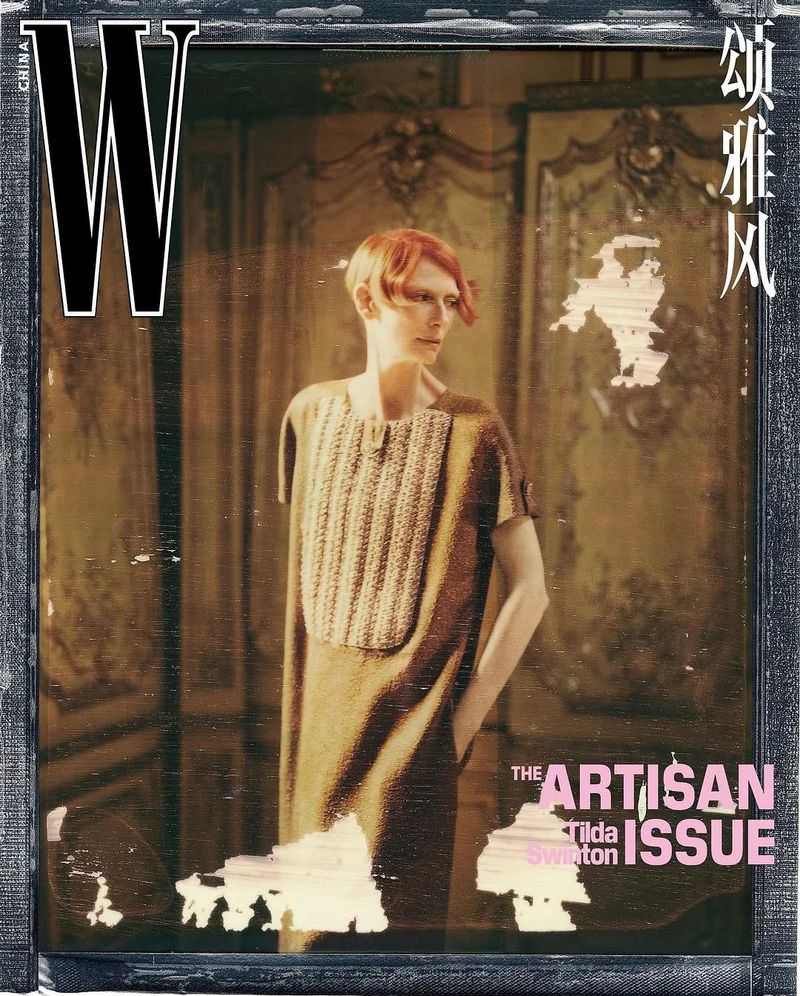 W Magazine cover featuring a woman in a dress posing against an ornate backdrop, framed by a dark, textured border and magazine text.