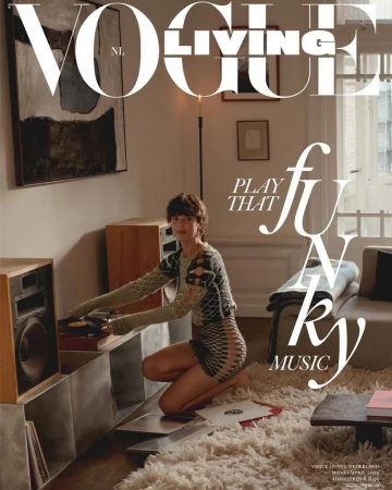 Vogue Living cover featuring a woman kneeling by record players, with vintage audio equipment and a modern interior setting, shot in warm light.