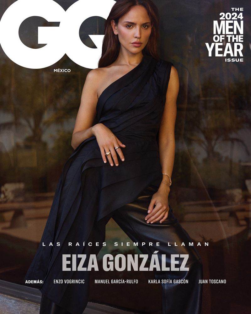 Eiza González on the cover of GQ México, 2024 Men of the Year issue. She's in a one-shoulder black dress, against a muted green background.
