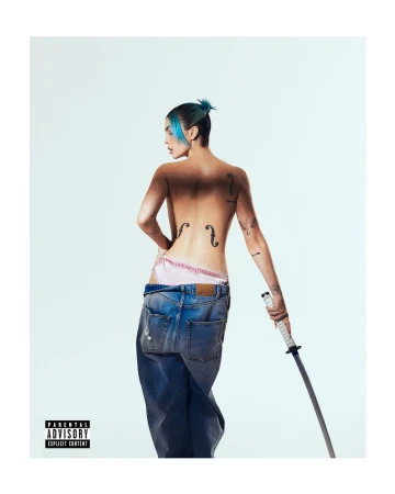 Topless woman with blue hair, back tattoos, and jeans poses in studio with katana, creating a striking and edgy visual statement.
