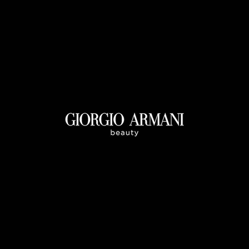Giorgio Armani Beauty logo against a black background. Elegant white sans-serif typography for luxury beauty and cosmetics brand.