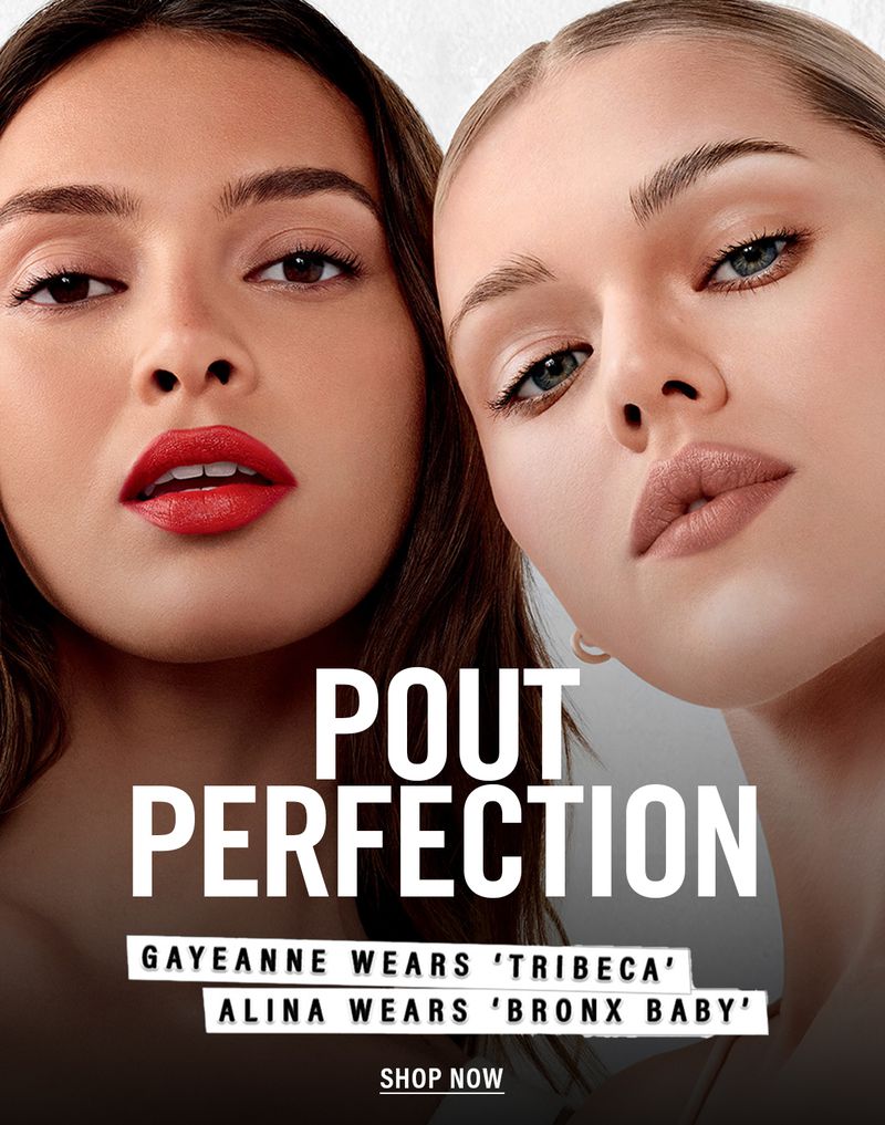Close-up of two women with bold lipstick in a beauty ad; fair and tan skin tones. White backdrop with black text overlay.