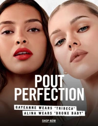 Close-up beauty portrait of two models wearing bold red and neutral nude lipsticks for Makeup by Mario.