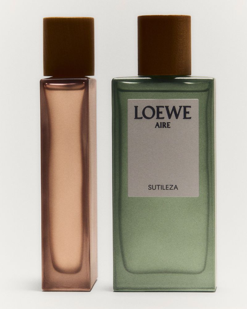 Two Loewe Aire Sutileza fragrances: a rose-tinted rectangular bottle and a green-tinted rectangular bottle with visible branding.