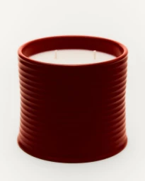 Loewe ribbed terracotta ceramic scented candle with two wicks against a plain white background.