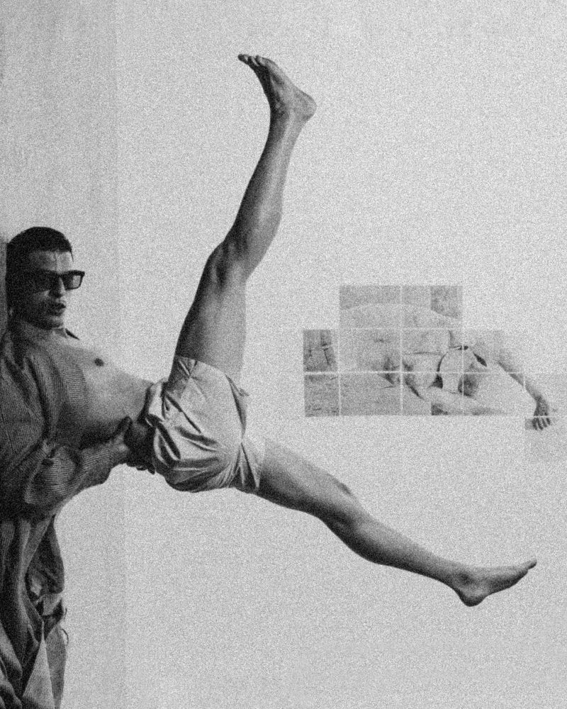 Monochromatic shot of a man in retro sunglasses balancing with one leg raised, featuring abstract human figure artwork in the background.