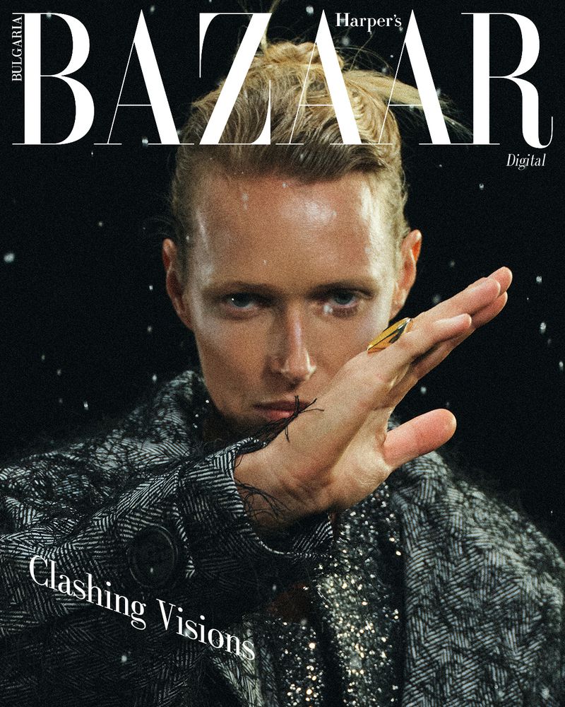 Magazine cover featuring a fashion model with wet blonde hair and a gray tweed jacket against a dark backdrop with white bokeh.