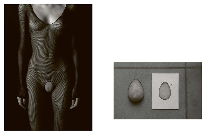 Monochrome studio shot featuring an adult in a fishnet bodysuit and an egg-shaped object displayed on a tile surface with a technical drawing.