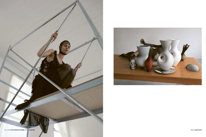 A woman in a black dress and head covering poses on a metal structure, contrasted with a still life of vases and a skull on a table.