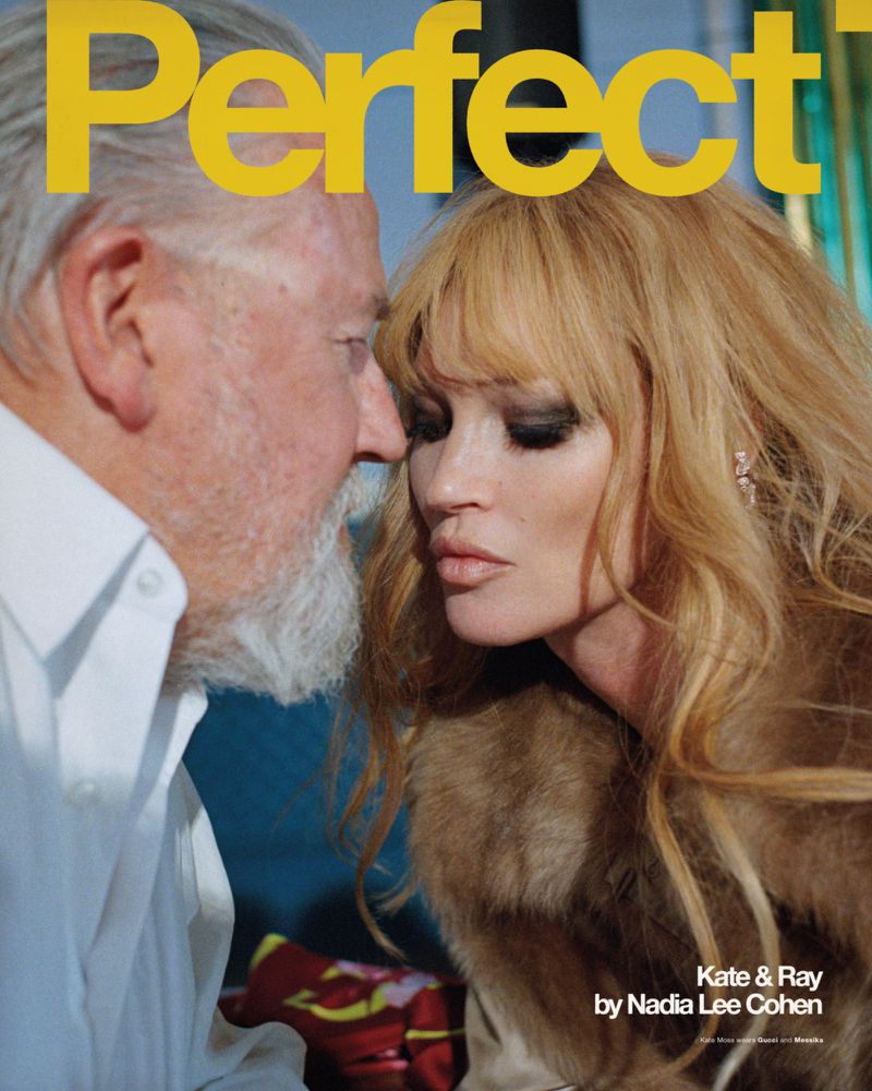 Magazine cover featuring an older man with a white beard and fair-skinned woman with blonde hair, heavy eye makeup, and fur collar.
