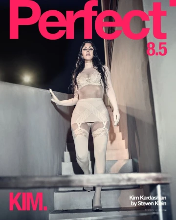 Kim Kardashian poses in lingerie on stairs for Perfect Magazine cover, shot by Steven Klein. Pink masthead and text on dark background.