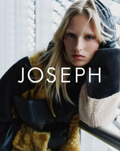 Model Vilma Friedlander wearing a black and ochre shearling coat and oversized mittens for the Joseph campaign.