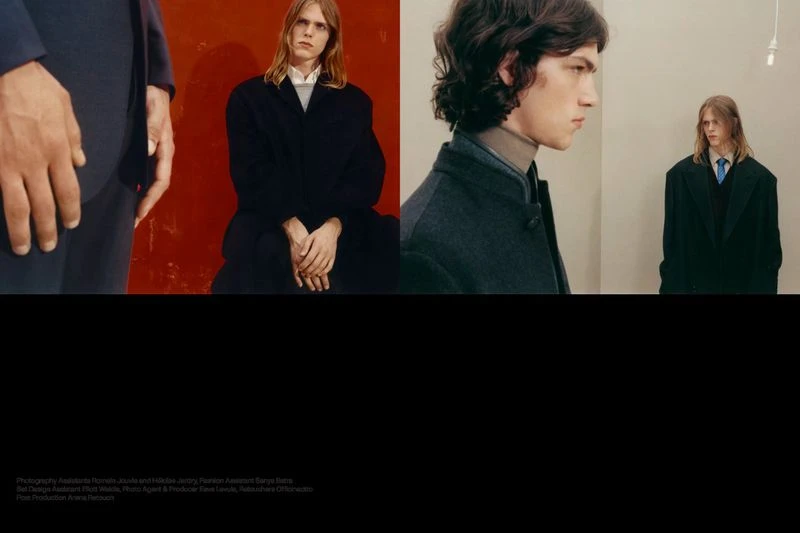 A fashion photograph features two young adult men in dark overcoats. The background alternates between red and white walls.