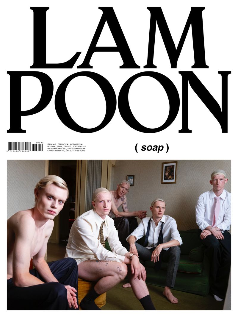 Magazine cover art featuring a group of pale-skinned men in a vintage-styled setting with stark lighting and an indoor backdrop.