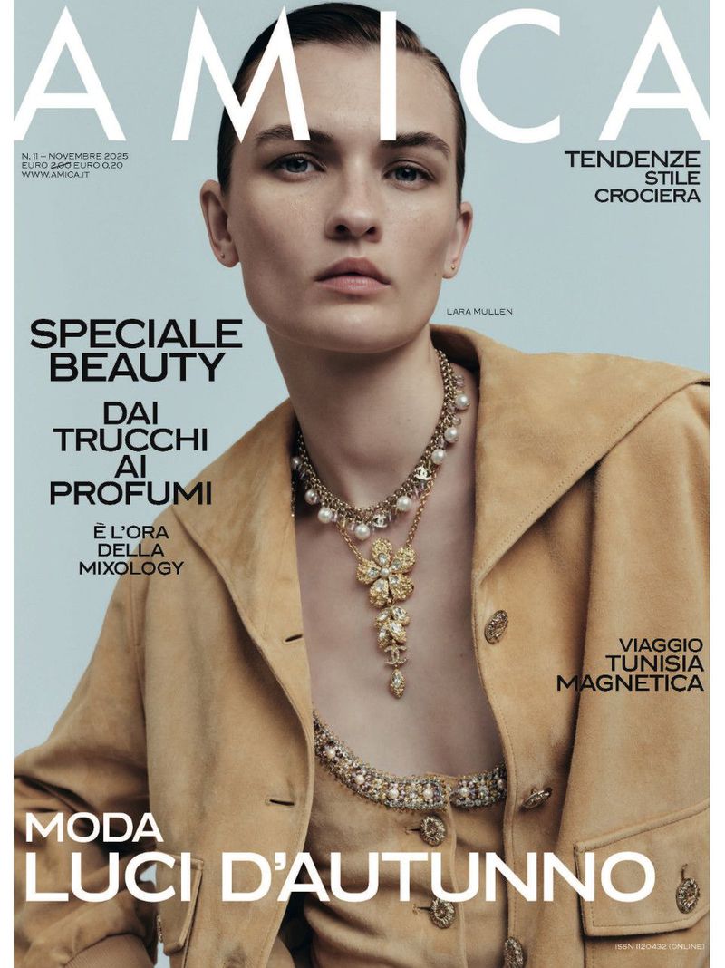 Amica magazine cover featuring a woman with short hair wearing a tan jacket and jewelry, with the magazine's title and other text.