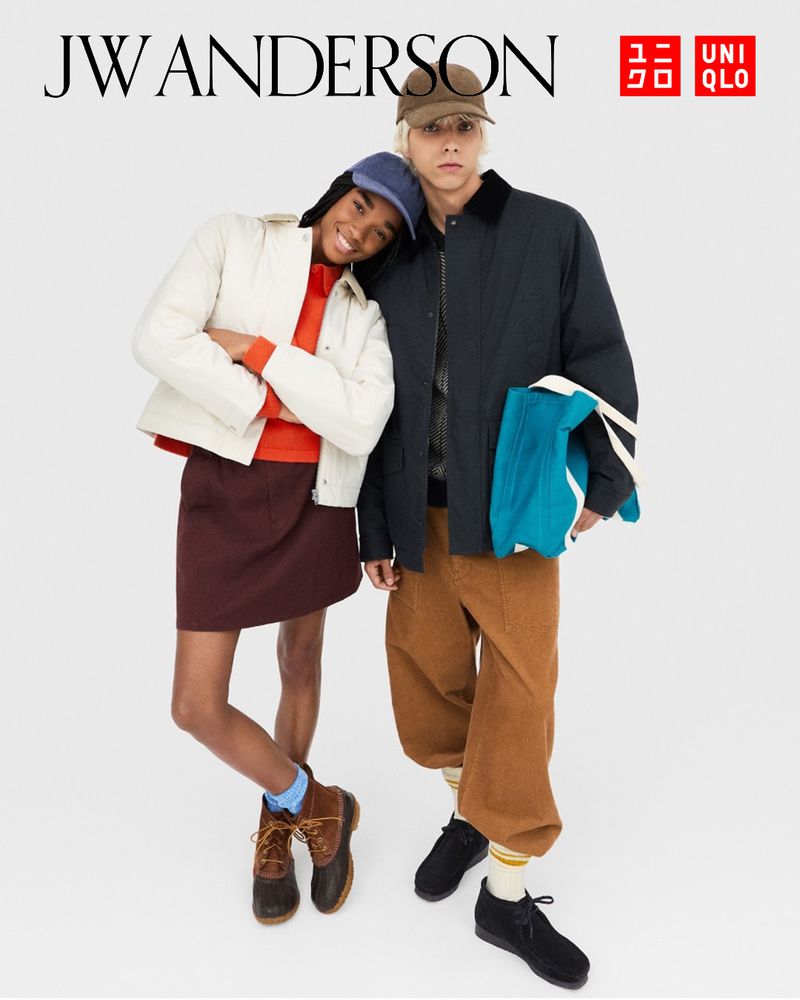 Two models, an adult female and an adult male, pose in a studio wearing clothing and accessories from JW Anderson and Uniqlo fashion brands.