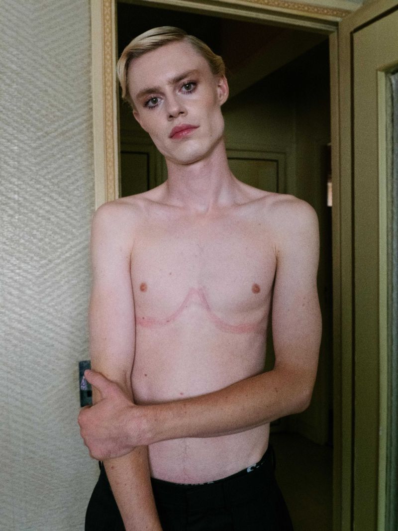 Shirtless male model posing in a doorway for Lampoon Magazine project Soap